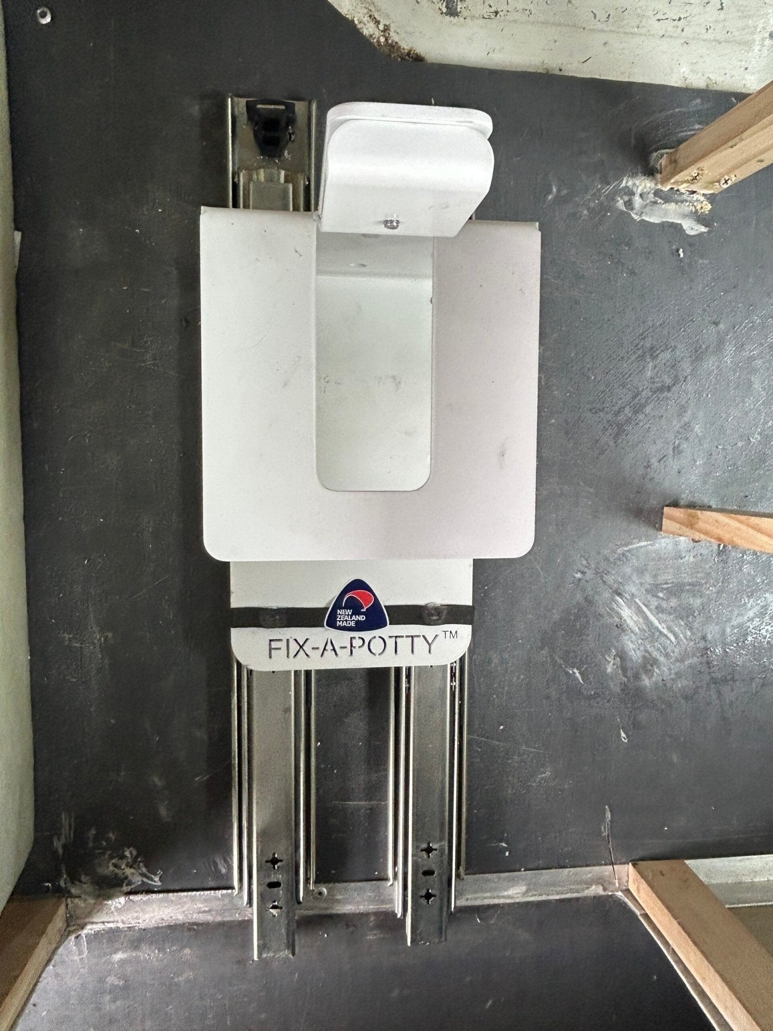 Sliding portable toilet bracket fitted for green warrant self-containment